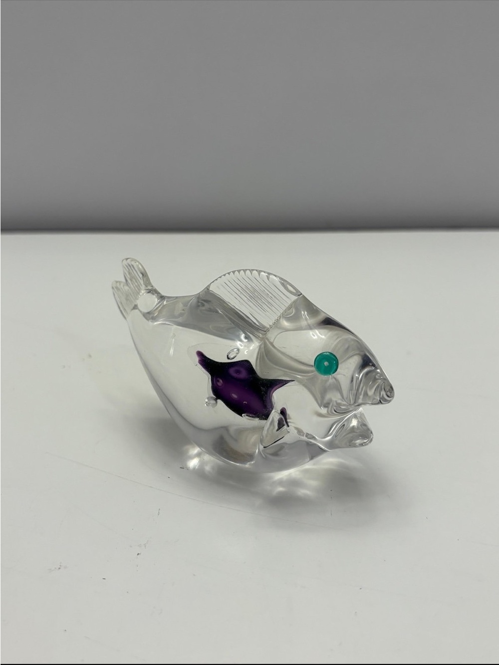 Art glass fish figurine clear with a purple insert and a small green eye